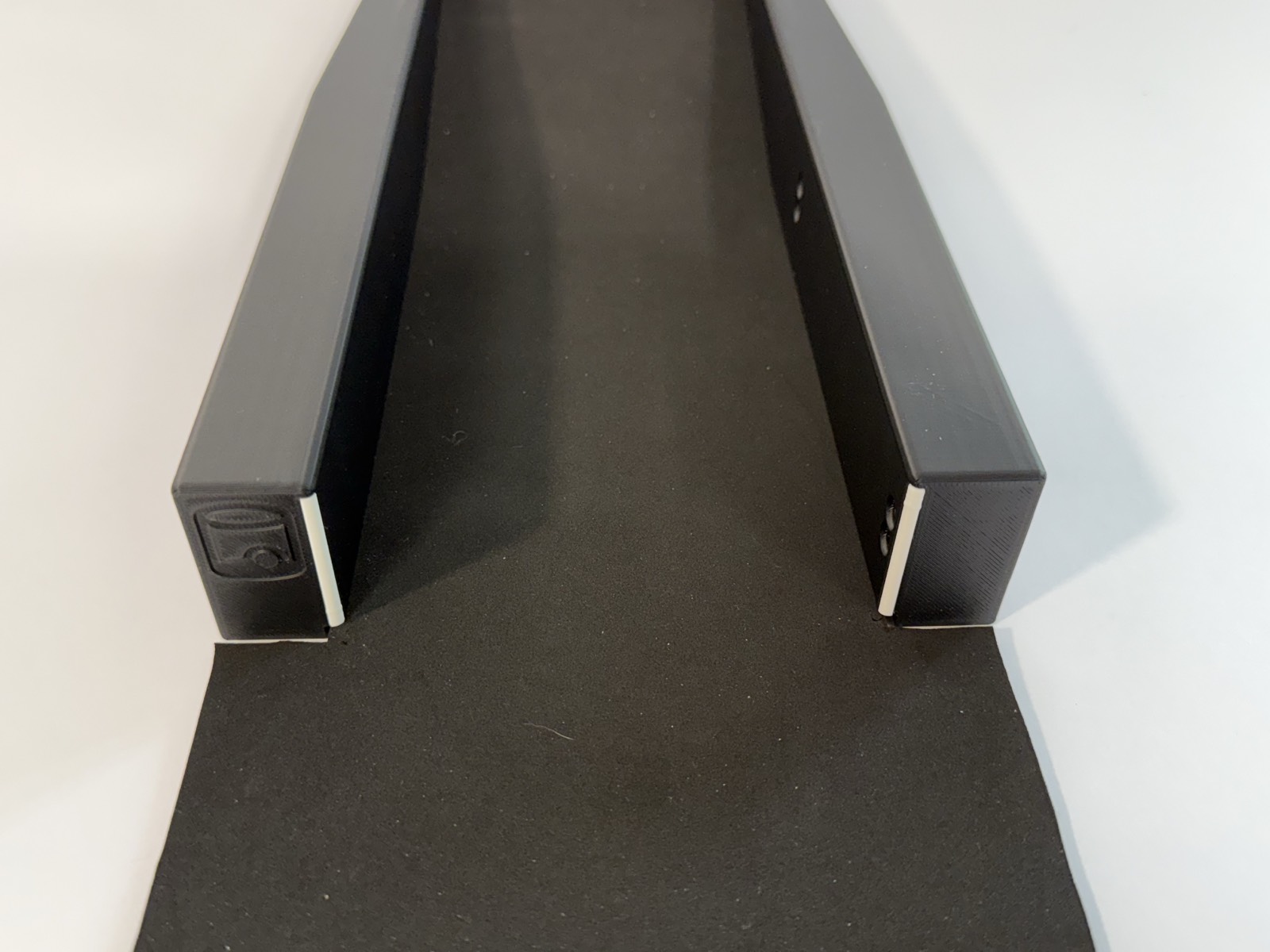 Close-up of the Speed Machine's ball return channel where the two side rails meet