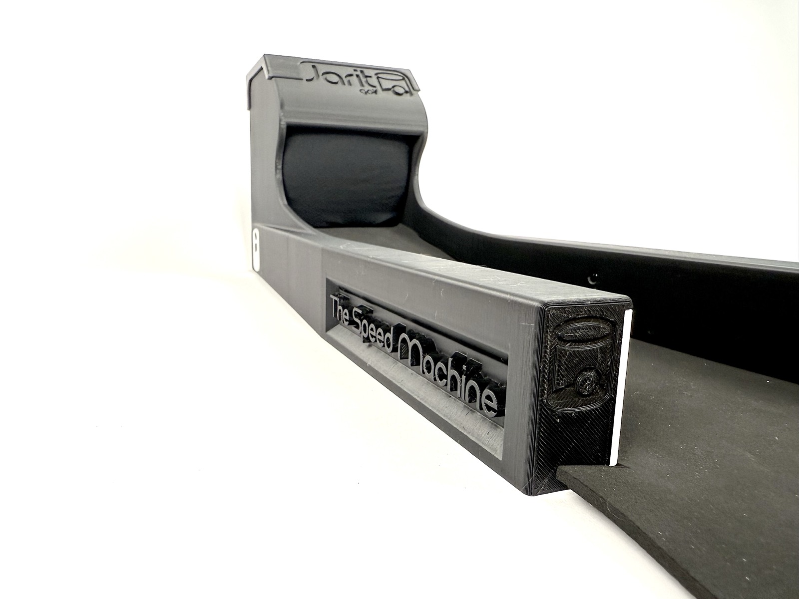 The Speed Machine's rail and ball chute close up, with the wordmark and Jarit Golf mark on the end cap
