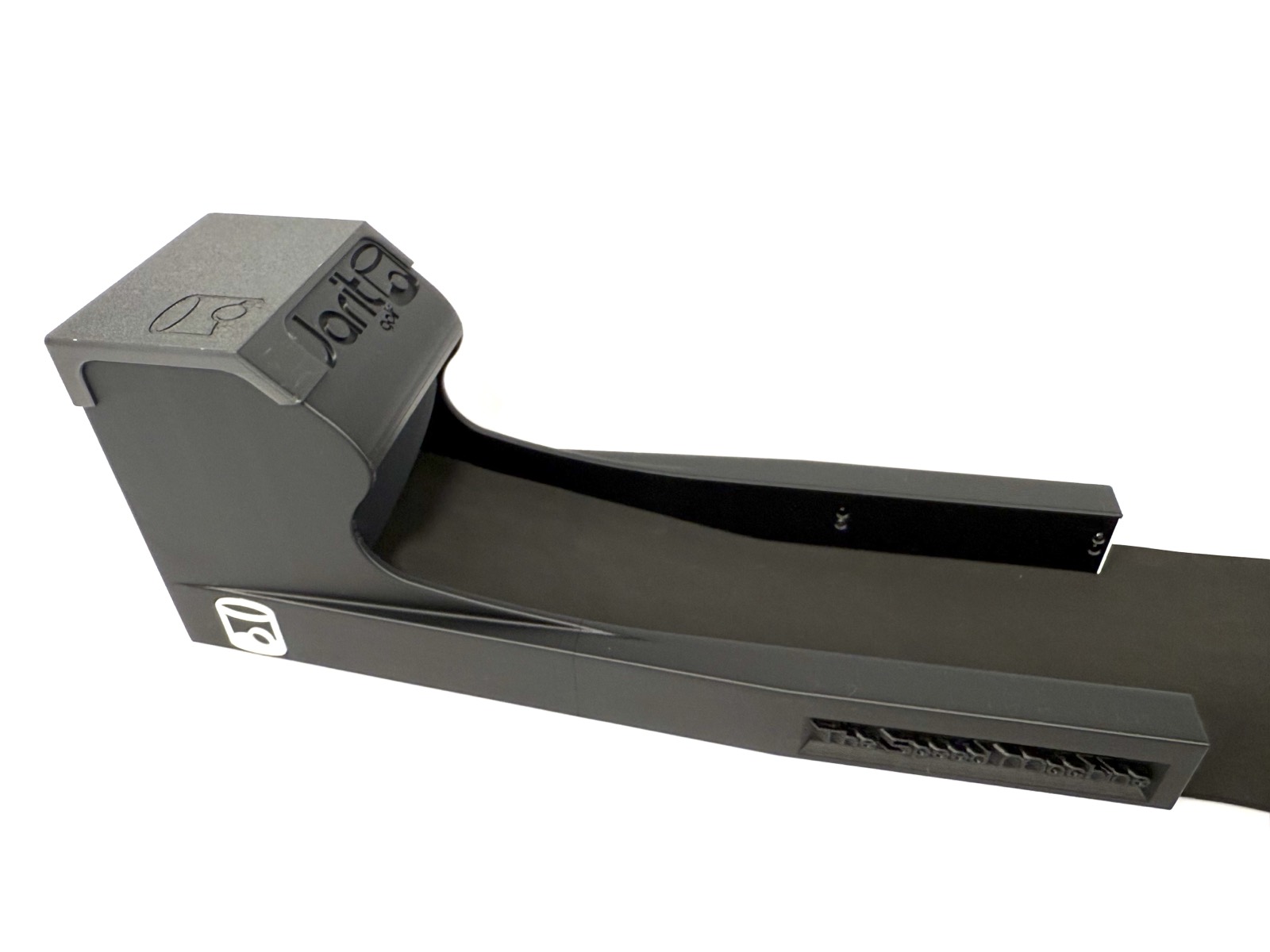 The Speed Machine from a raised three-quarter angle, showing the open return track running back to the mat