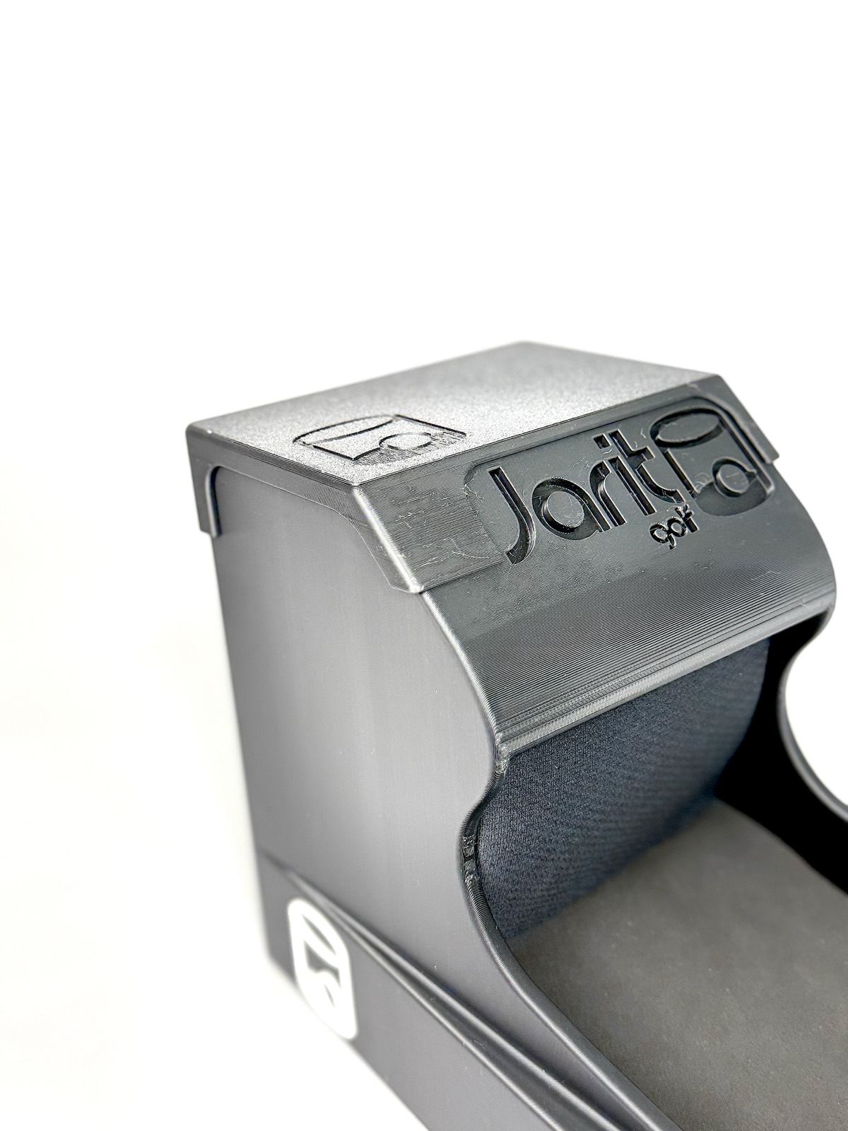 Close-up of the top of the Speed Machine, with the Jarit Golf wordmark and logo embossed into the housing
