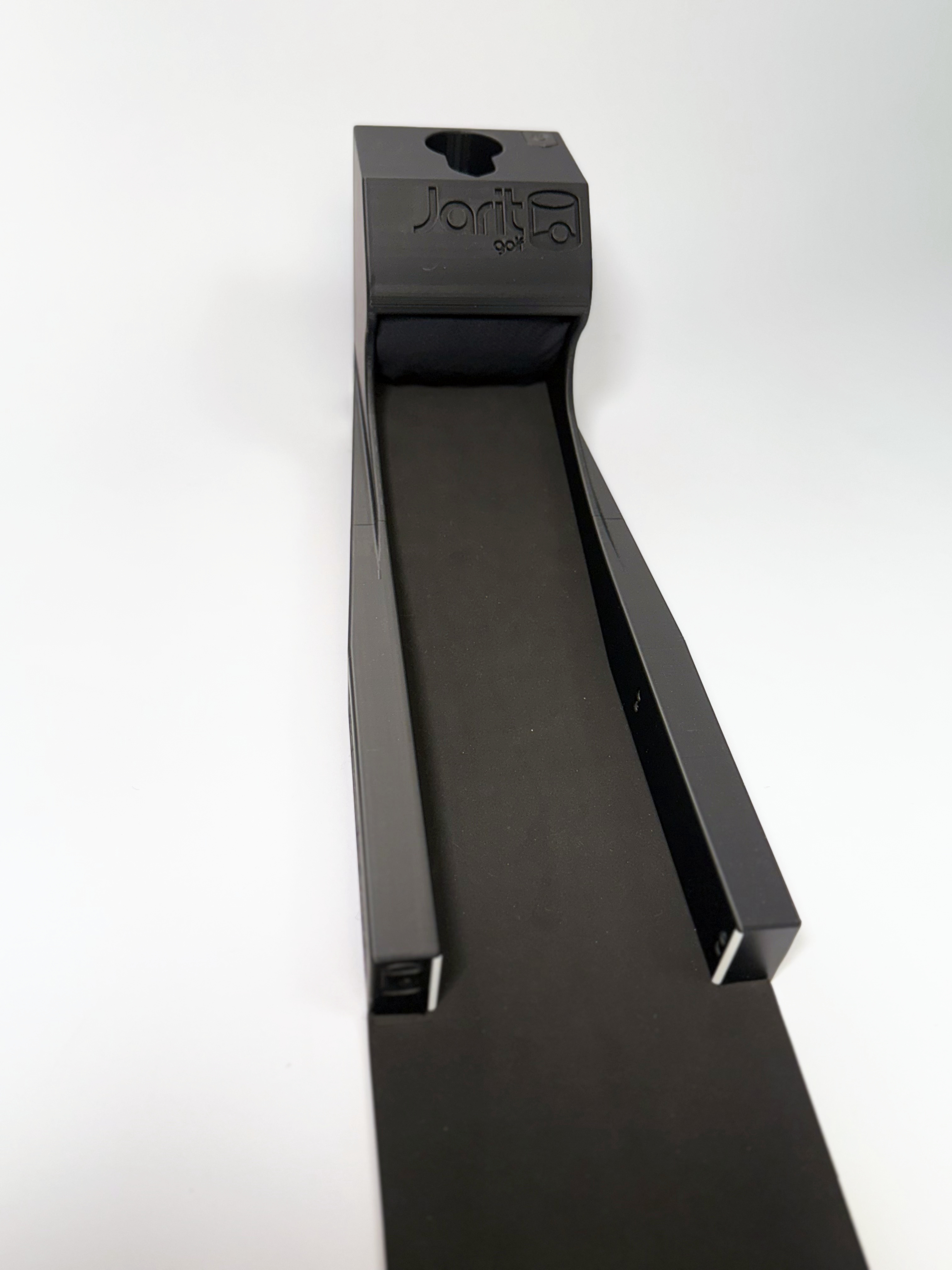 Looking down the mat into the Speed Machine: the two side rails narrowing to the tower with the Jarit Golf wordmark moulded into its hood